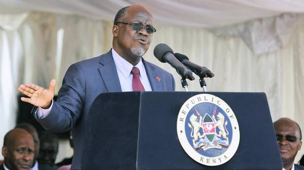epa05612607 Visiting Tanzanian President John Magufuli (C) delivers his speech during the official commissioning ceremony of the Nairobi Southern Bypass road in Nairobi, Kenya, 01 November 2016. President Magufuli concluded his two-day State visit by joining President Uhuru Kenyatta in launching the 28.6km key road which is said will help decongest the Kenyan city.  EPA/DANIEL IRUNGU