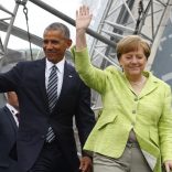 German Chancellor Angela Merkel and former U.S. President Barack Obama wave as they attend a discussion at the German Protestant Kirchentag in front of the Brandenburg Gate in Berlin, Germany, May 25, 2017. REUTERS/Fabrizio Bensch