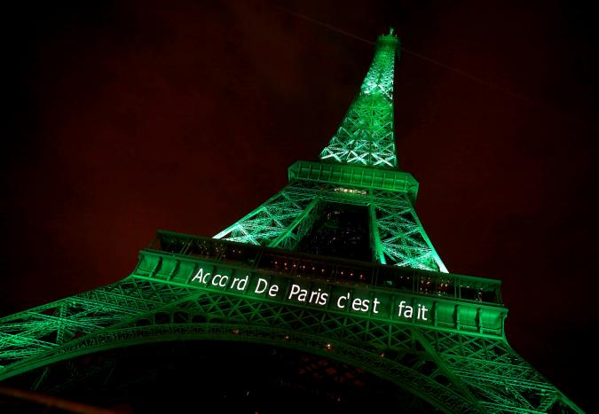 FILE PHOTO: The Eiffel tower is illuminated in green with the words "Paris Agreement is Done", to celebrate the Paris U.N. COP21 Climate Change agreement in Paris, France, November 4, 2016. REUTERS/Jacky Naegelen/File Photo