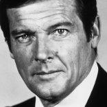 circa 1975:  Studio headshot portrait of English actor Roger Moore wearing a jacket and tie.  (Photo by American Stock/Getty Images)