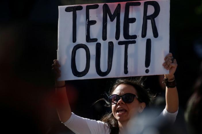 A woman demonstrates against Brazil's president Michel Temer during a protest in Union Square in the Manhattan borough of New York City, New York, U.S. May 21, 2017.   REUTERS/Carlo Allegri