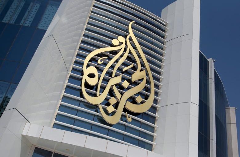 FILE PHOTO: The logo of Al Jazeera Media Network is seen on its headquarters building in Doha, Qatar June 8, 2017. REUTERS/Naseem Zeitoon/File Photo