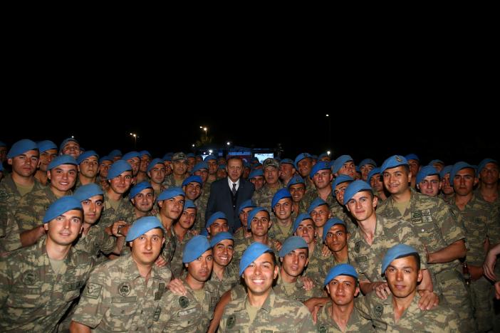 Turkish President Tayyip Erdogan poses with commandos following a fast-breaking iftar dinner at the 1. Commando Brigade in Kayseri, Turkey, June 8, 2017.  Kayhan Ozer/Presidential Palace/Handout via REUTERS