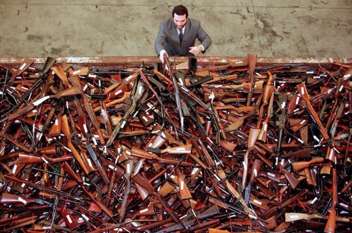 FILE PHOTO - Mick Roelandts, firearms reform project manager for the New South Wales Police, looks at a pile of around 4,500 prohibited firearms that have been handed in over the past month under the Australian government's buy-back scheme in Sydney, Australia, July 28, 2017.       REUTERS/David Gray/File photo