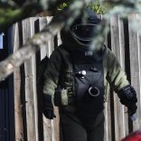 A bomb squad member walks outside the site of a shooting at Buckingham Serviced Apartments in Brighton, Melbourne, Australia, June 6, 2017.      AAP/Julian Smith/via REUTERS