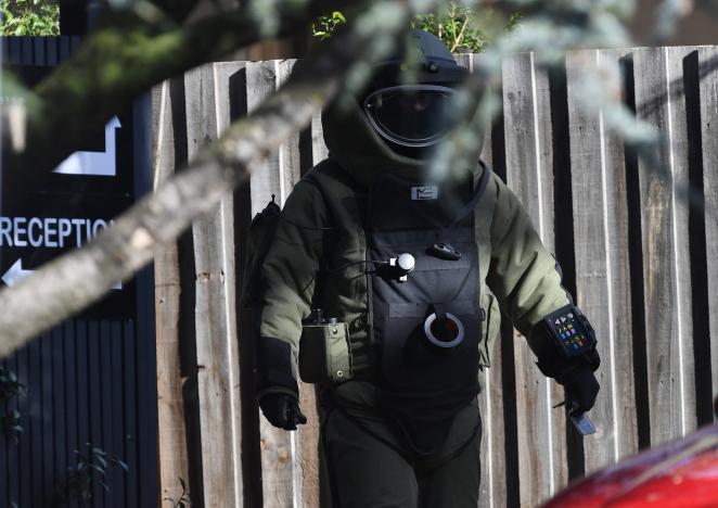 A bomb squad member walks outside the site of a shooting at Buckingham Serviced Apartments in Brighton, Melbourne, Australia, June 6, 2017.      AAP/Julian Smith/via REUTERS