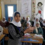 Syrian refugee Omayma al Hushan, 14, who launched an initiative against child marriage among Syrian refugees, speaks to her friends about her initiative at a school in Al Zaatari refugee camp in the Jordanian city of Mafraq, near the border with Syria, April 21, 2016. REUTERS/Muhammad Hamed