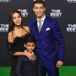 TOPSHOT - Real Madrid and Portugal's forward Cristiano Ronaldo poses with partner Georgina Rodriguez and his son Cristiano Ronaldo Jr as they arrive for The Best FIFA Football Awards 2016 ceremony, on January 9, 2017 in Zurich. / AFP / MICHAEL BUHOLZER        (Photo credit should read MICHAEL BUHOLZER/AFP/Getty Images)