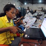 TO GO WITH AFP STORY BY Cecile DE COMARMOND
A worker scans a product to ascertain its originality at the Ikeja warehouse of the company in Lagos on June 12, 2013. JUMIA is a Nigerian based online retail company, where customers purchase their electronics, books, phones, DVDs and other choice products and have them shipped directly to their homes or offices with several payment options to choose from. JUMIA, the fourth largest Nigerian website, which recently turned one years old have hit over half a million customers in the country. Jumia is funded by Rocket Internet, a Germany based Internet incubators globally responsible for starting market leading e-commerce companies. AFP PHOTO / PIUS UTOMI EKPEI        (Photo credit should read PIUS UTOMI EKPEI/AFP/Getty Images)