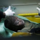 A child rescued from the rubble of a building that collapsed in a residential area receives medical attention inside an ambulance in Nairobi, Kenya June 13, 2017. REUTERS/Baz Ratner