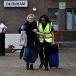 A resident is evacuated from the Burnham Tower residential block as a precautionary measure following concerns over the type of cladding used on the outside of the building on the Chalcots Estate in north London, Britain, June 24, 2017. REUTERS/Hannah McKay