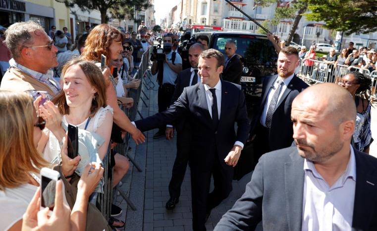 French President Emmanuel Macron shakes hands as he arrives in Le Touquet, on the eve of the first round of the parliamentary election, France June 10, 2017. REUTERS/Philippe Wojazer