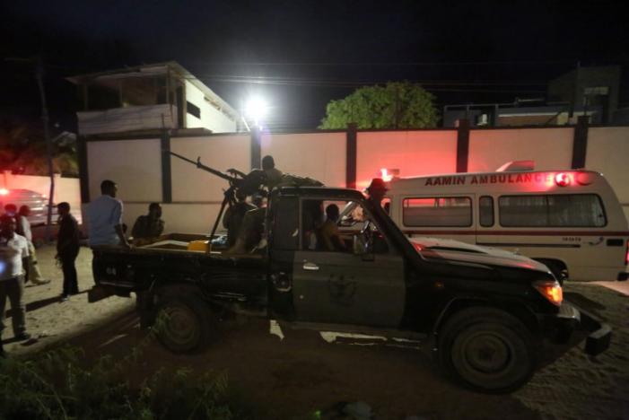 Armed security forces and rescue personnel are seen at the scene of an attack outside an hotel in Mogadishu, Somalia June 14, 2017. REUTERS/Stringer