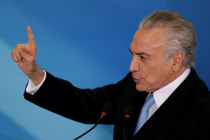 FILE PHOTO: Brazil's President Michel Temer gestures during a inauguration ceremony of the new Minister of Justice, Torquato Jardim, at the Planalto Palace, in Brasilia, Brazil May 31, 2017. REUTERS/Ueslei Marcelino/File Photo