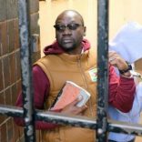 Handcuffed Pastor Evan Mawarire arrives at court after he was arrested for addressing students demonstrating over fees in Harare, Zimbabwe June 28,2017. REUTERS/Philimon Bulawayo