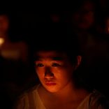 A girl takes part in a candlelight vigil to mark the 28th anniversary of the crackdown of the pro-democracy movement at Beijing's Tiananmen Square in 1989, at Victoria Park in Hong Kong, China June 4, 2017. REUTERS/Bobby Yip