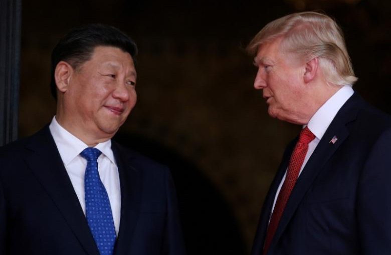 FILE PHOTO: U.S. President Donald Trump welcomes Chinese President Xi Jinping at Mar-a-Lago state in Palm Beach, Florida, U.S., April 6, 2017. REUTERS/Carlos Barria/File Photo