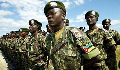 10 Jun 2004, Mozambique --- Mozambique Defence Force Army stands guard during a joint exercise in Nacala, north of Maputo in Mozambique, June 10, 2004. French troops and forces from at least four southern African countries including Botswana, ended a 10-day military exercise on Thursday aimed at strengthening Africa's capability to carry out its own peacekeeping missions. | Location: NACALA, Mozambique.  --- Image by © JUDA NGWENYA/Reuters/Corbis