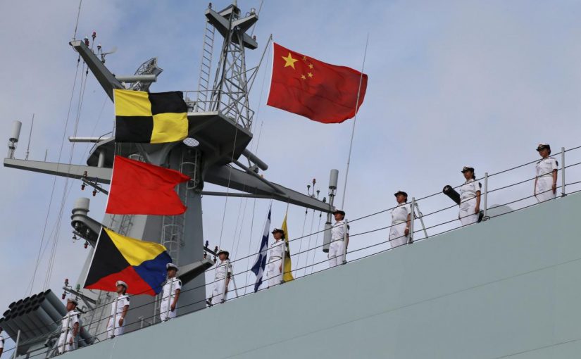 Soldiers of China's People's Liberation Army (PLA) stand on a ship sailing off from a military port in Zhanjiang, Guangdong province, July 11, 2017. REUTERS/Stringer