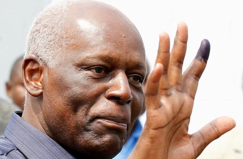 FILE PHOTO: Angola's President Jose Eduardo dos Santos shows off his inked finger to photographers after casting his vote during national elections in the capital Luanda, August 31, 2012.  REUTERS/Siphiwe Sibeko/File Photo