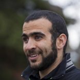 Omar Khadr smiles as he answers questions during a news conference after being released on bail in Edmonton, Alberta, May 7, 2015. Khadr, a Canadian, was once the youngest prisoner held on terror charges at Guantanamo Bay.       REUTERS/Todd Korol