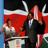 Kenyan opposition leader Raila Odinga, the presidential candidate of the National Super Alliance (NASA) coalition, escorted by his granddaughter, arrives for a Presidential Debate ahead of a general election in Nairobi, Kenya, July 24, 2017. REUTERS/Thomas Mukoya