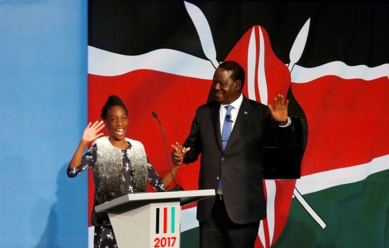 Kenyan opposition leader Raila Odinga, the presidential candidate of the National Super Alliance (NASA) coalition, escorted by his granddaughter, arrives for a Presidential Debate ahead of a general election in Nairobi, Kenya, July 24, 2017. REUTERS/Thomas Mukoya