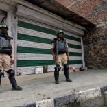 Indian policemen stand guard in front of closed shops during a curfew in the downtown area of Srinagar July 21, 2017. REUTERS/Danish Ismail