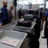 FILE PHOTO: Baggage and a laptop are scanned using the Transport Security Administration's new Automated Screening Lane technology at Terminal 4 of JFK airport in New York City, U.S., May 17, 2017. REUTERS/Joe Penney/File Photo