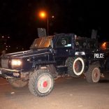 Malian police stand guard in an armored vehicle near the site of an attack on a hotel in Bamako that had been converted into the headquarters of a European Union military training operation, March 21, 2016. REUTERS/Adama Diarra