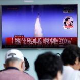 People watch a TV broadcast of a news report on North Korea's ballistic missile test, at a railway station in Seoul, South Korea, July 4, 2017.  REUTERS/Kim Hong-Ji