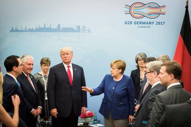 German Chancellor Angela Merkel welcomes U.S. President Donald Trump before bilateral talks on the eve of the G-20 summit in Hamburg, Germany, July 6, 2017.  Steffen Kugler/Courtesy of Bundesregierung/Handout via REUTERS