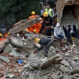 Firefighters and rescue workers search for survivors at the site of a collapsed building in the suburbs of Mumbai, India, July 25, 2017. REUTERS/Danish Siddiqui