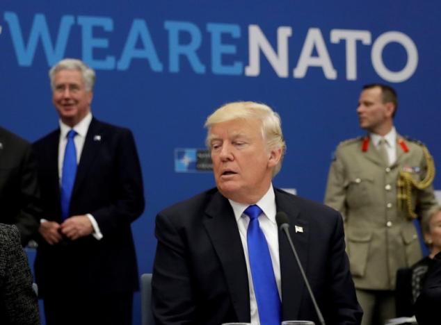 FILE PHOTO: U.S. President Donald Trump attends a working dinner meeting at the NATO headquarters during a NATO summit of heads of state and government in Brussels, Belgium, May 25, 2017.     REUTERS/Matt Dunham/Pool/File Photo