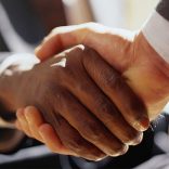 Mhoje_handshake_photo_jpg