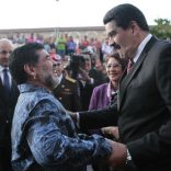 Venezuela's President Nicolas Maduro (R) greets former Argentine soccer star Diego Maradona during a ceremony at the national pantheon in Caracas in this December 9, 2014 handout photo provided by Miraflores Palace. REUTERS/Miraflores Palace/Handout via Reuters