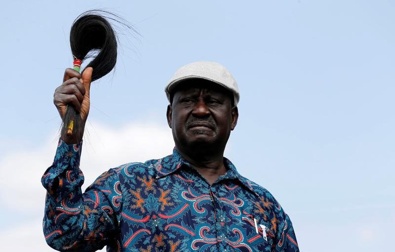 Opposition leader Raila Odinga greets supporters as he arrives to address a rally in Kibera slum, Nairobi, Kenya, August 13, 2017. REUTERS/Thomas Mukoya