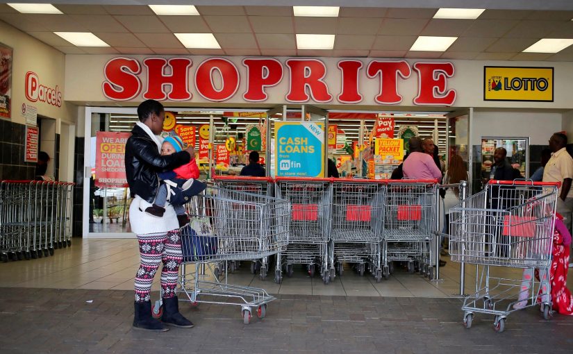 A shopper is seen outside a Shoprite store in Johannesburg July 7, 2015.  REUTERS/Siphiwe Sibeko/File Photo - RTX2MO0A
