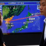 Pedestrians walk past a TV set showing news about North Korea's missile launch in Tokyo, Japan, August 29, 2017.   REUTERS/Kim Kyung-Hoon