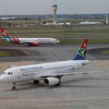 FILE PHOTO: A South African Airways aircraft (bottom) arrives as a Kenya Airways aircraft prepares to take off at the OR Tambo International Airport in Johannesburg, South Africa, March 8, 2017. REUTERS/Siphiwe Sibeko/File Photo