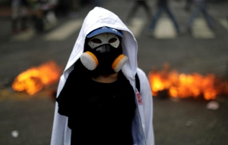 A demonstrator looks on while rallying against Venezuela's President Nicolas Maduro's government in Caracas, Venezuela, August 4, 2017. REUTERS/Ueslei Marcelino