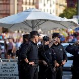 Police officers stand at a road block at the beginning of fiestas in Bilbao, Spain August 19, 2017, after a van ran down pedestrians in Barcelona's Las Ramblas on Thursday. REUTERS/Vincent West