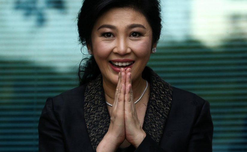FILE PHOTO: Ousted former Thai prime minister Yingluck Shinawatra greets supporters as she arrives at the Supreme Court in Bangkok