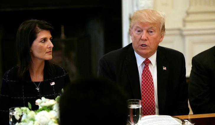 FILE PHOTO: With U.S. Ambassador to the United Nations Nikki Haley at his side (L), U.S. President Donald Trump speaks during a working lunch with ambassadors of countries on the UN Security Council at the White House in Washington, U.S., April 24, 2017.  REUTERS/Kevin Lamarque