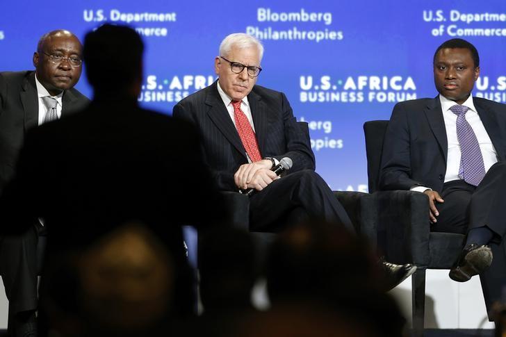 Donald Kaberuka (L) takes a question from the audience as he leads a panel discussion including Carlyle Group CEO (C) and Standard Bank Chief Executive Sim Tshabalala (R) during the U.S.-Africa Business Forum in Washington August 5, 2014.    REUTERS/Jonathan Ernst