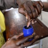A voter's finger is marked after voting in the general election in Maputo October 15, 2014. REUTERS/Grant Lee Neuenburg