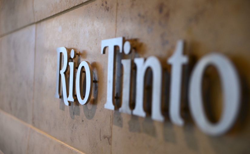 The Rio Tinto Group logo is mounted on a wall near the reception area of the company's offices in Melbourne, Australia, on Thursday, Feb. 28, 2013. Rio Tinto, the world's second-biggest mining company, named non-executive board director Christopher Lynch as chief financial officer to replace Guy Elliott who announced his retirement in July. Photographer: Carla Gottgens/Bloomberg via Getty Images
