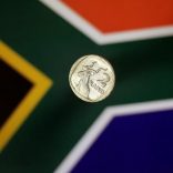 Illustration photo shows a two-rand coin above a South African flag April 12, 2017.   REUTERS/Thomas White