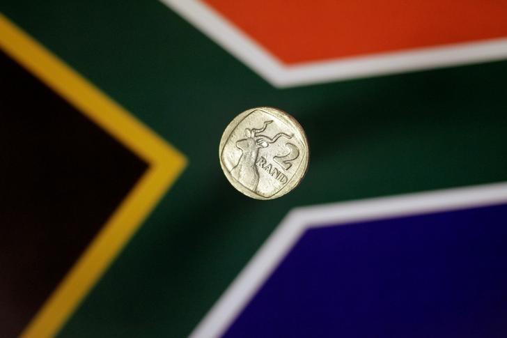 Illustration photo shows a two-rand coin above a South African flag April 12, 2017.   REUTERS/Thomas White