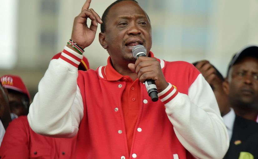 Kenya's President Uhuru Kenyatta (L) of the Jubilee Party addresses his supporters on May 29, 2017 in Nairobi after receiving the clearance certificate of the Independent Electoral and Boundaries Commission (IEBC) following the presentation of his candidacy for the presidential race. / AFP PHOTO / SIMON MAINA        (Photo credit should read SIMON MAINA/AFP/Getty Images)